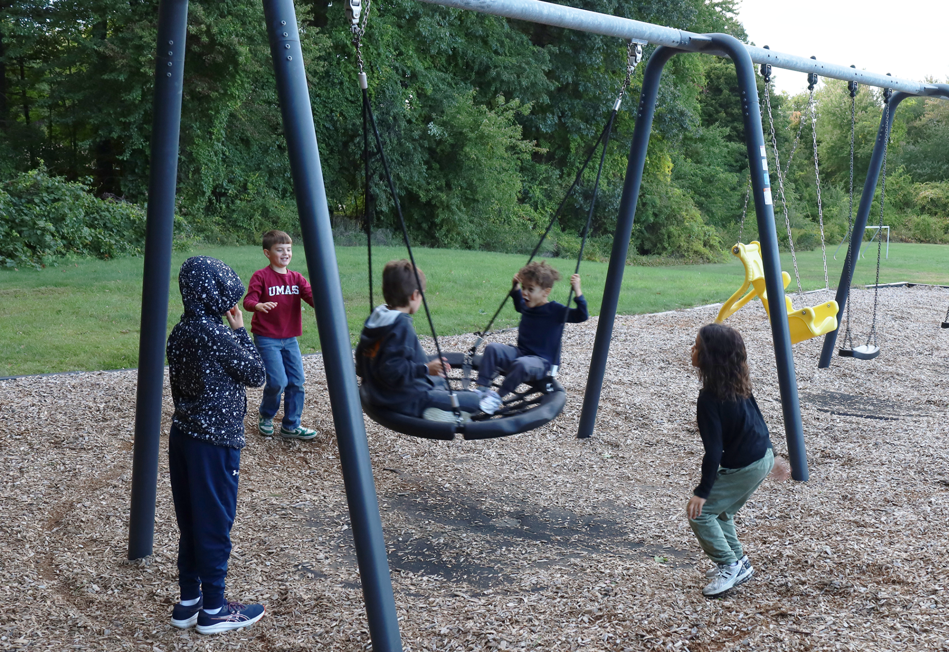 Children play on the equipment in the playground outside Byam Elementary School during the Back To School Social on Thursday, Sept. 24, 2026.