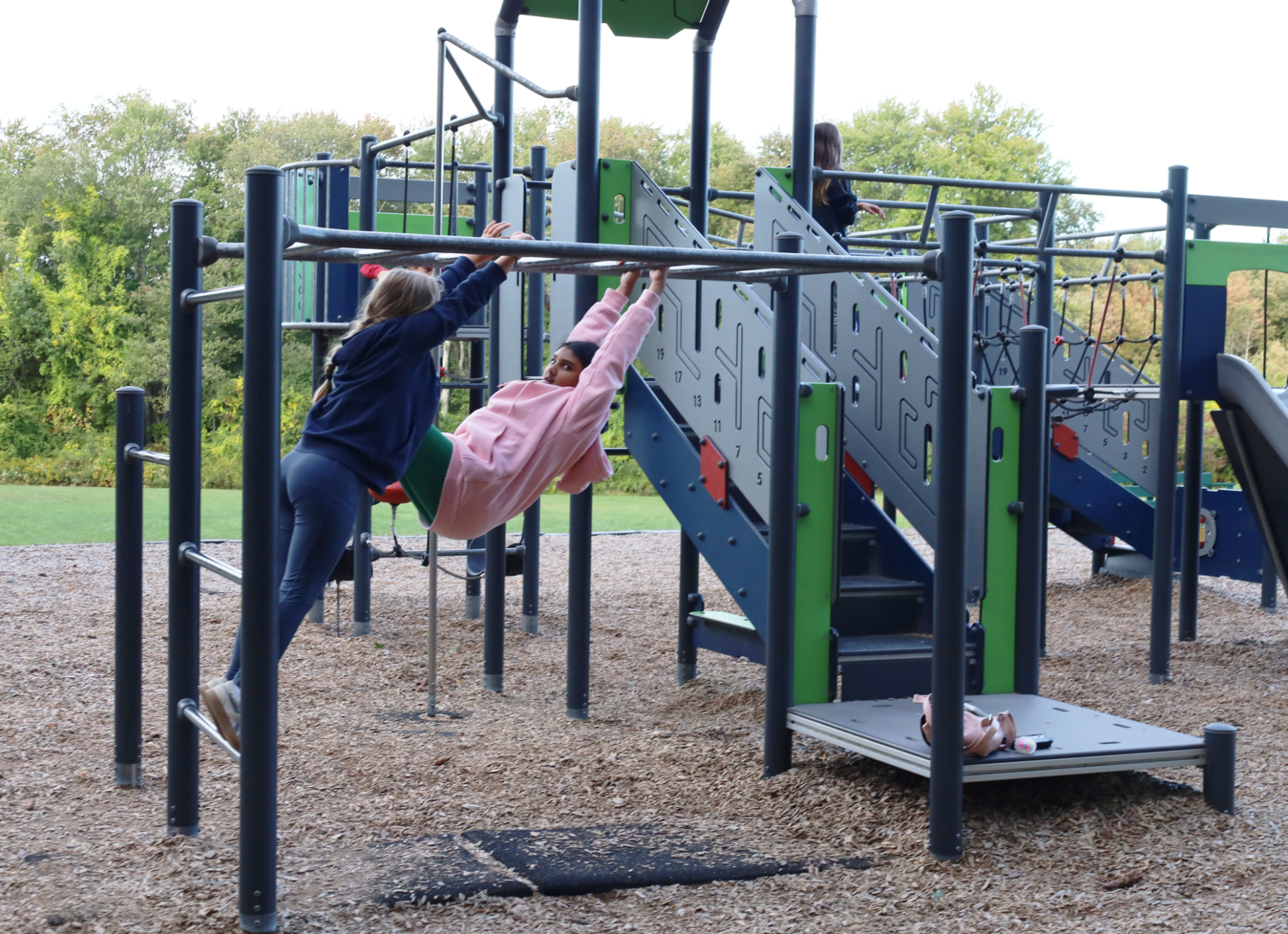 Children play on the equipment in the playground outside Byam Elementary School during the Back To School Social on Thursday, Sept. 24, 2026.