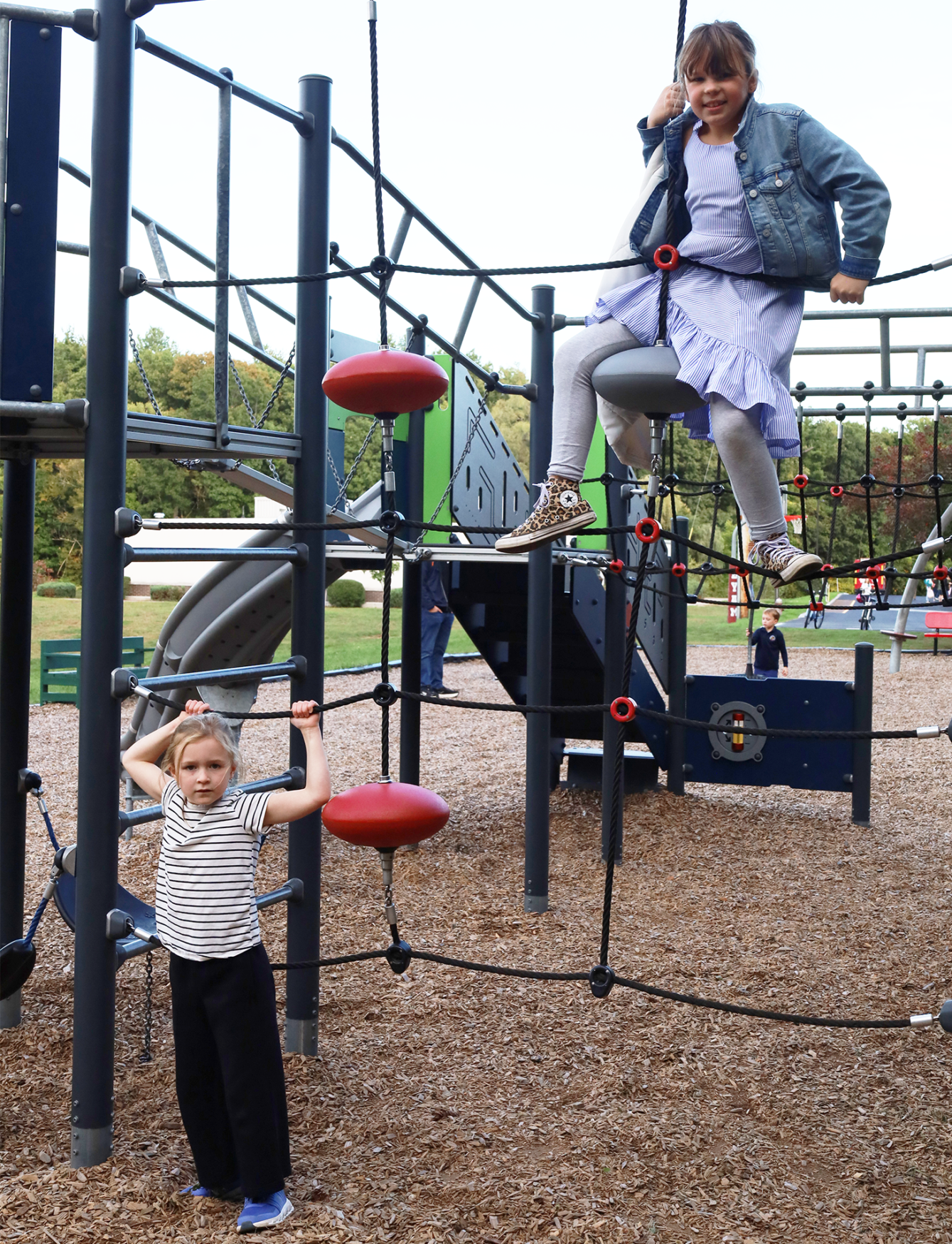Children play on the equipment in the playground outside Byam Elementary School during the Back To School Social on Thursday, Sept. 24, 2026.