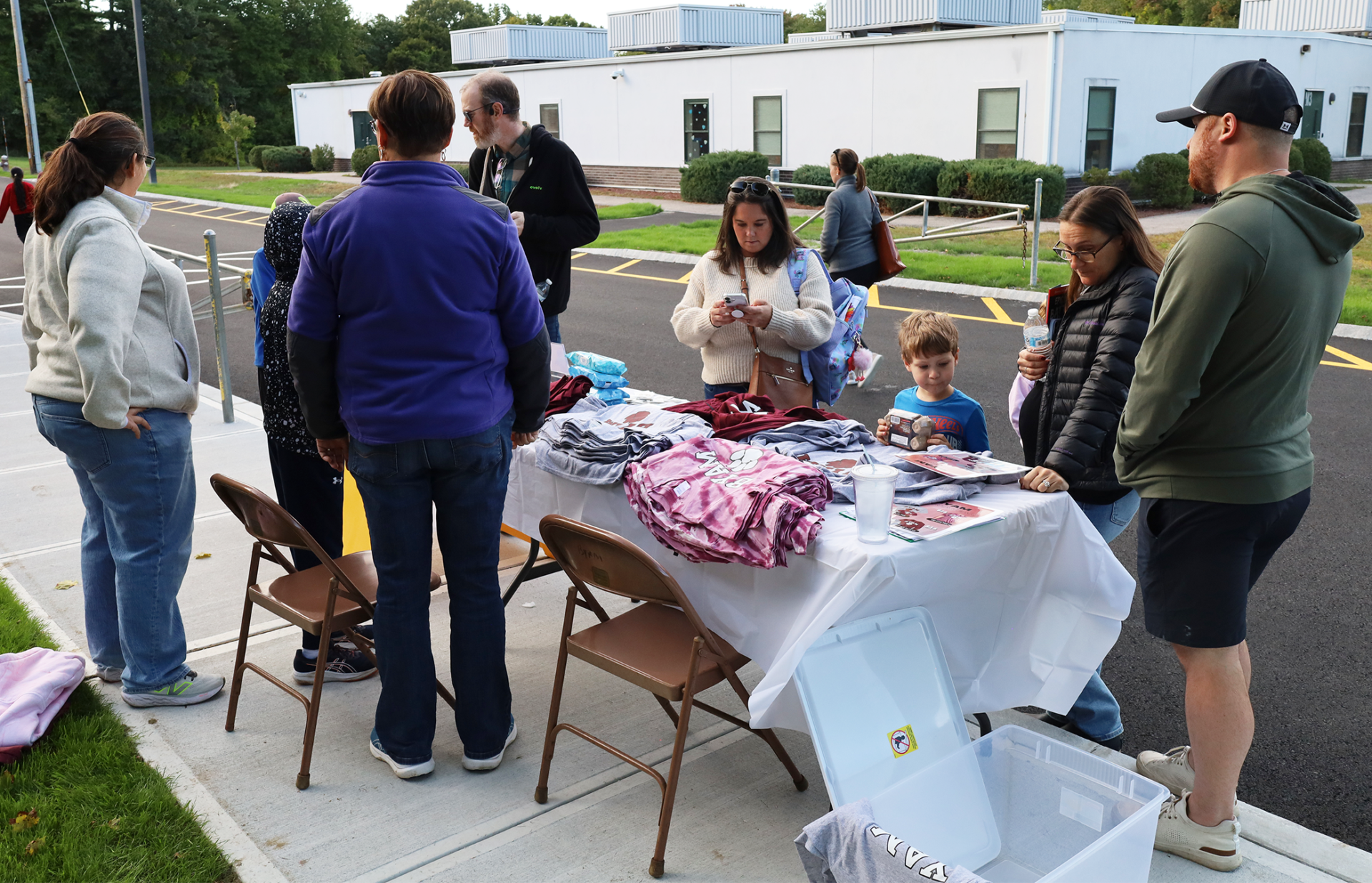Families peruse spirit merchandise outside Byam Elementary School during the Back To School Social on Thursday, Sept. 24, 2026.