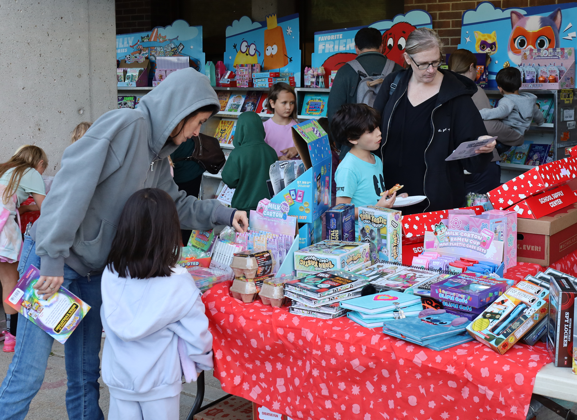 Families peruse books at the Scholastic Book Fair outside Byam Elementary School during the Back To School Social on Thursday, Sept. 24, 2026.