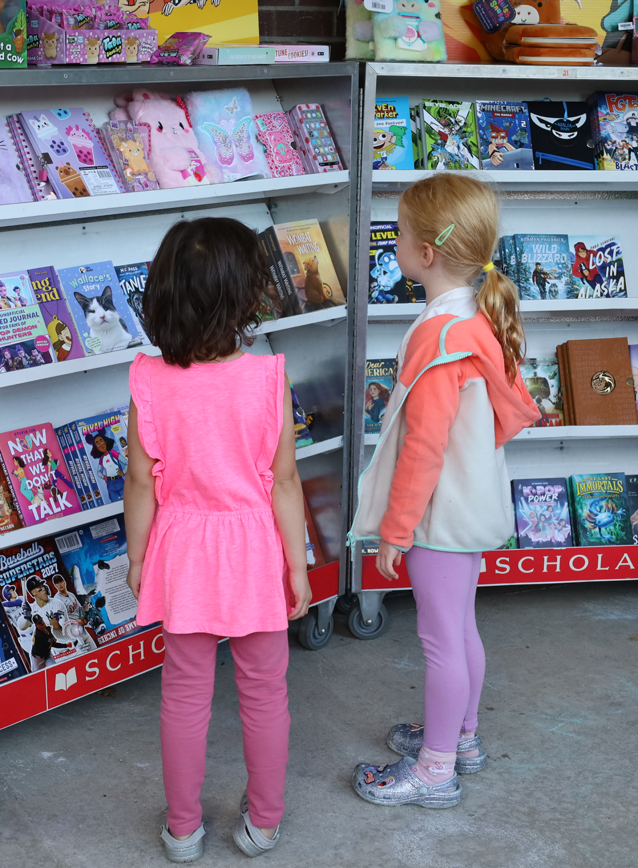 Children peruse books at the Scholastic Book Fair outside Byam Elementary School during the Back To School Social on Thursday, Sept. 24, 2026.