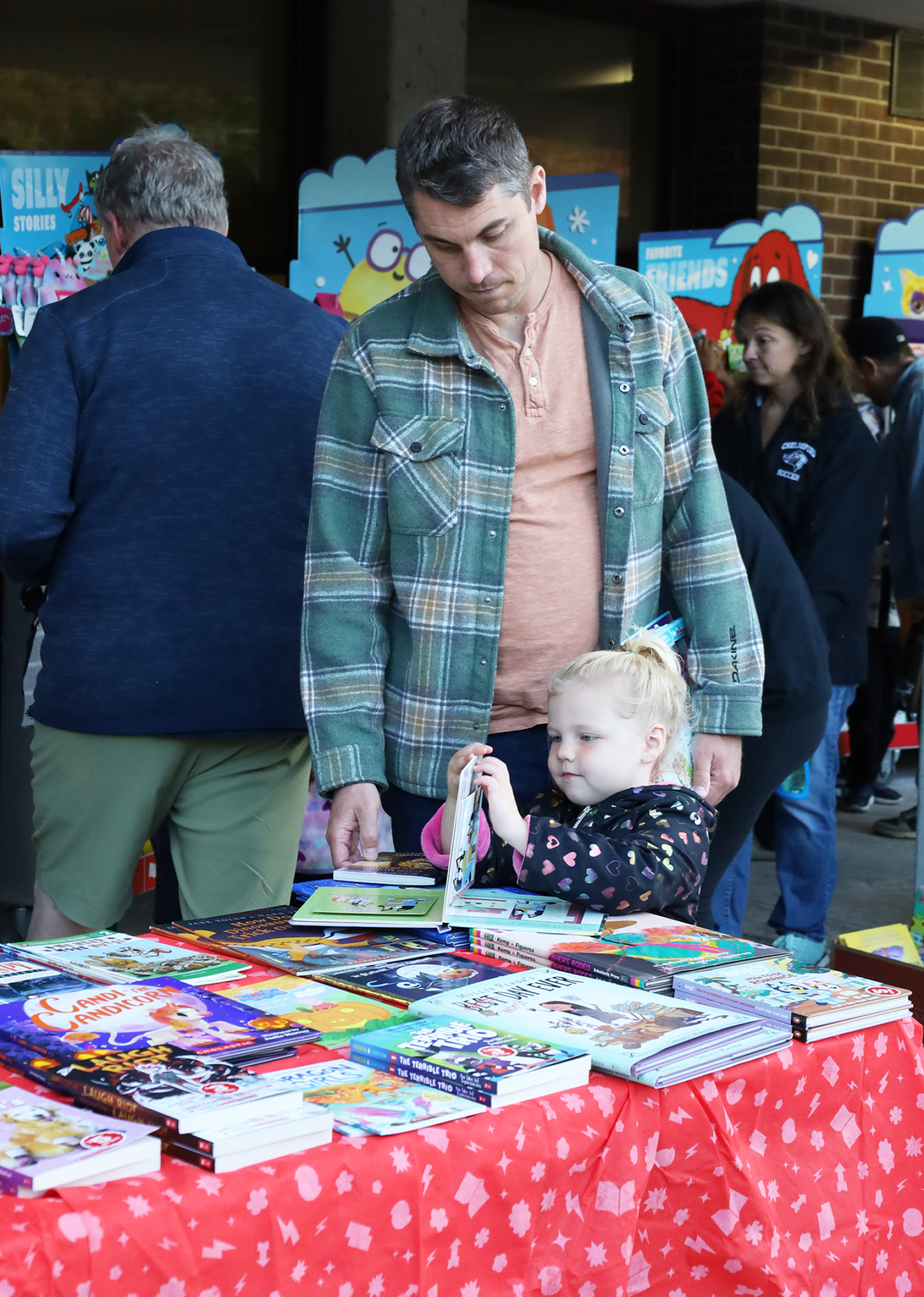Families peruse books at the Scholastic Book Fair outside Byam Elementary School during the Back To School Social on Thursday, Sept. 24, 2026.